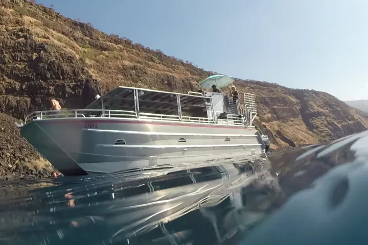 a boat sitting on top of a mountain