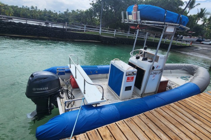 a boat is docked next to a body of water
